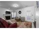 Cozy living room with fireplace, plush seating, and natural light at 6972 Sandtown Ln, Stone Mountain, GA 30087