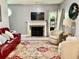Cozy living room featuring a fireplace, area rug, and plush furniture at 6972 Sandtown Ln, Stone Mountain, GA 30087