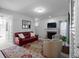 Relaxing living room with natural light, fireplace, and comfortable seating at 6972 Sandtown Ln, Stone Mountain, GA 30087