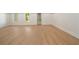 Spacious basement with light wood floors, white walls, and natural light from two windows at 1068 Moores Mill Nw Rd, Atlanta, GA 30327