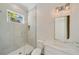 Modern bathroom featuring glass-enclosed shower, stylish vanity, and contemporary lighting at 1068 Moores Mill Nw Rd, Atlanta, GA 30327