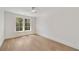 Bright bedroom with hardwood floors, white trim, and a large window at 1068 Moores Mill Nw Rd, Atlanta, GA 30327