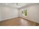 Bright bedroom with hardwood floors, white trim, and a large window at 1068 Moores Mill Nw Rd, Atlanta, GA 30327