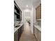 Charming butler pantry features a sink, marble countertops, cabinetry, wine cooler and storage at 1068 Moores Mill Nw Rd, Atlanta, GA 30327
