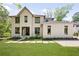 Charming home with a manicured lawn, eye-catching architecture, and lovely front yard landscaping at 1068 Moores Mill Nw Rd, Atlanta, GA 30327