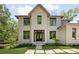 Beautiful home with detailed wood trim, a manicured lawn, and impeccable curb appeal at 1068 Moores Mill Nw Rd, Atlanta, GA 30327