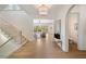Spacious foyer with hardwood floors, staircase, and an arched doorway into another room at 1068 Moores Mill Nw Rd, Atlanta, GA 30327