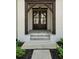 Close-up of the home's entryway with stylish double doors and a covered porch at 1068 Moores Mill Nw Rd, Atlanta, GA 30327