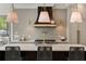 Close-up of a kitchen island featuring white countertops, pendant lighting, and modern appliances at 1068 Moores Mill Nw Rd, Atlanta, GA 30327