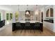 Spacious kitchen with a large center island, pendant lighting, and modern stainless steel appliances at 1068 Moores Mill Nw Rd, Atlanta, GA 30327