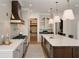 Bright kitchen featuring stainless steel appliances, a large island, and hardwood floors at 1068 Moores Mill Nw Rd, Atlanta, GA 30327