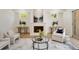 Cozy living room with a fireplace, ample seating, and a modern rug on hardwood floors at 1068 Moores Mill Nw Rd, Atlanta, GA 30327