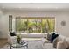 Bright living room with large sliding doors, comfortable seating, and views of the outdoor landscape at 1068 Moores Mill Nw Rd, Atlanta, GA 30327
