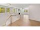 Open living room features many windows, hardwood floors, recessed lighting, and a fireplace at 1068 Moores Mill Nw Rd, Atlanta, GA 30327