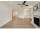 Spacious living room features a fireplace, ceiling fan, and hardwood floors at 1068 Moores Mill Nw Rd, Atlanta, GA 30327