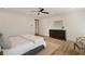 Main bedroom featuring hardwood floors, a ceiling fan, and a decorative area rug at 1068 Moores Mill Nw Rd, Atlanta, GA 30327