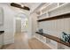 Functional mudroom featuring built-in bench, cubbies, coat hooks, and wood beam details at 1068 Moores Mill Nw Rd, Atlanta, GA 30327