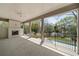 Covered patio featuring a fireplace, outdoor fan, and pool view at 1068 Moores Mill Nw Rd, Atlanta, GA 30327