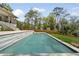 Backyard view of a modern pool surrounded by lush landscaping at 1068 Moores Mill Nw Rd, Atlanta, GA 30327