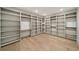 Large walk-in closet with custom built-in shelving and hardwood floors at 1068 Moores Mill Nw Rd, Atlanta, GA 30327