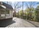 Spacious wooden deck with railing offers serene backyard views at 1074 Moores Mill Nw Rd, Atlanta, GA 30327