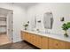 A double vanity with sleek light fixtures and plenty of storage space at 1074 Moores Mill Nw Rd, Atlanta, GA 30327