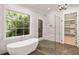 This bathroom features a garden tub, walk-in shower, and large window at 1074 Moores Mill Nw Rd, Atlanta, GA 30327