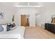 Bright bedroom featuring vaulted ceilings, a sliding wood door, and a view into the closet at 1074 Moores Mill Nw Rd, Atlanta, GA 30327