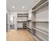 Spacious walk-in closet with custom shelving and window at 1074 Moores Mill Nw Rd, Atlanta, GA 30327