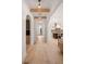 Hallway featuring archways, hardwood floors, a wine rack, and an entrance to the kitchen at 1074 Moores Mill Nw Rd, Atlanta, GA 30327