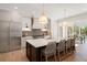 Bright kitchen features a spacious island, stainless steel appliances, and a cozy dining area at 1074 Moores Mill Nw Rd, Atlanta, GA 30327