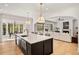 Spacious open concept kitchen features a large island and seamless flow to the living area at 1074 Moores Mill Nw Rd, Atlanta, GA 30327
