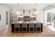 Modern kitchen boasts a large island with counter seating and modern appliances at 1074 Moores Mill Nw Rd, Atlanta, GA 30327