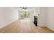 Bright living room with fireplace, ceiling fan and access to outdoor space at 1074 Moores Mill Nw Rd, Atlanta, GA 30327