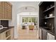 View of the open-concept living room featuring a wine bar and modern design at 1074 Moores Mill Nw Rd, Atlanta, GA 30327