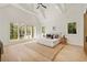 Bright and airy main bedroom boasts vaulted ceilings and large windows with scenic views at 1074 Moores Mill Nw Rd, Atlanta, GA 30327