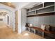 Mudroom with built-in shelving, hooks, seating, and detailed trim and arches at 1074 Moores Mill Nw Rd, Atlanta, GA 30327