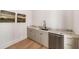 Butler's pantry with stone countertop, under counter fridge, and custom cabinets at 1074 Moores Mill Nw Rd, Atlanta, GA 30327