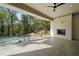 Outdoor patio features an open fireplace and access to a stunning pool with tree-lined view at 1074 Moores Mill Nw Rd, Atlanta, GA 30327