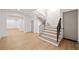 An entry hall with a wooden staircase and natural light at 1074 Moores Mill Nw Rd, Atlanta, GA 30327