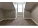 Attic area that features neutral paint, updated carpet, and base trim molding at 1124 Lawton Sw Pl, Atlanta, GA 30310