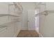 Spacious walk-in closet with shelving, great for organization and clothing storage at 1124 Lawton Sw Pl, Atlanta, GA 30310