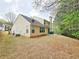 The backyard features a lush lawn and a wooded perimeter, ensuring privacy at 1972 Ashwood Grove Dr, Snellville, GA 30078