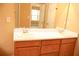 Bathroom boasts double sink vanity, ample lighting, and neutral decor at 1972 Ashwood Grove Dr, Snellville, GA 30078
