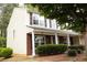 Charming two-story home with a covered porch and traditional design elements at 1972 Ashwood Grove Dr, Snellville, GA 30078