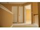 Hallway with neutral carpet and white doors leading to various rooms at 1972 Ashwood Grove Dr, Snellville, GA 30078
