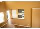Bright living room with soaring ceilings, a fireplace, and an adjacent kitchen at 1972 Ashwood Grove Dr, Snellville, GA 30078