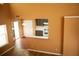 Bright living room with soaring ceilings, a fireplace, and an adjacent kitchen at 1972 Ashwood Grove Dr, Snellville, GA 30078