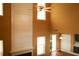 Living room featuring soaring ceilings, fireplace, windows, and a ceiling fan at 1972 Ashwood Grove Dr, Snellville, GA 30078