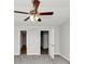 Second bedroom with new carpet, bright windows, and two entry doors at 222 Alton Cir, Villa Rica, GA 30180